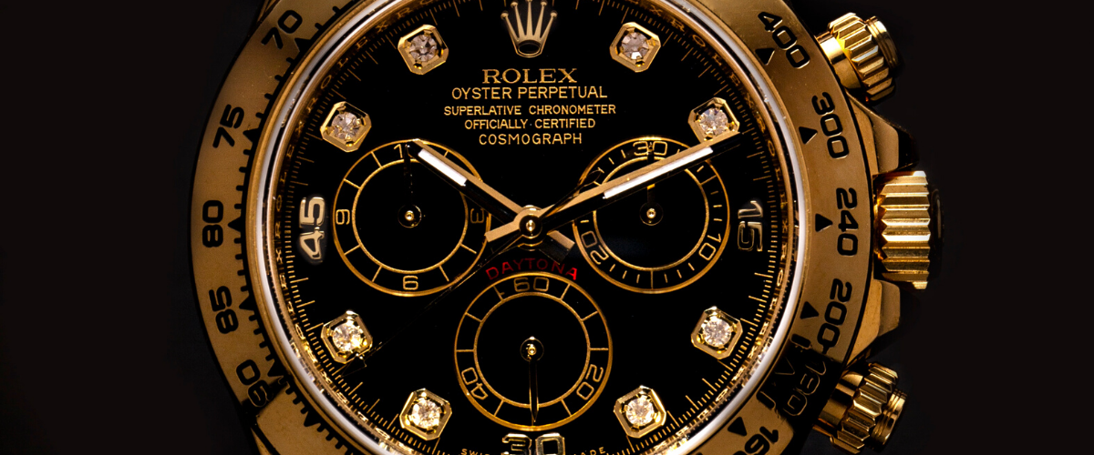Gold luxury watch on black background